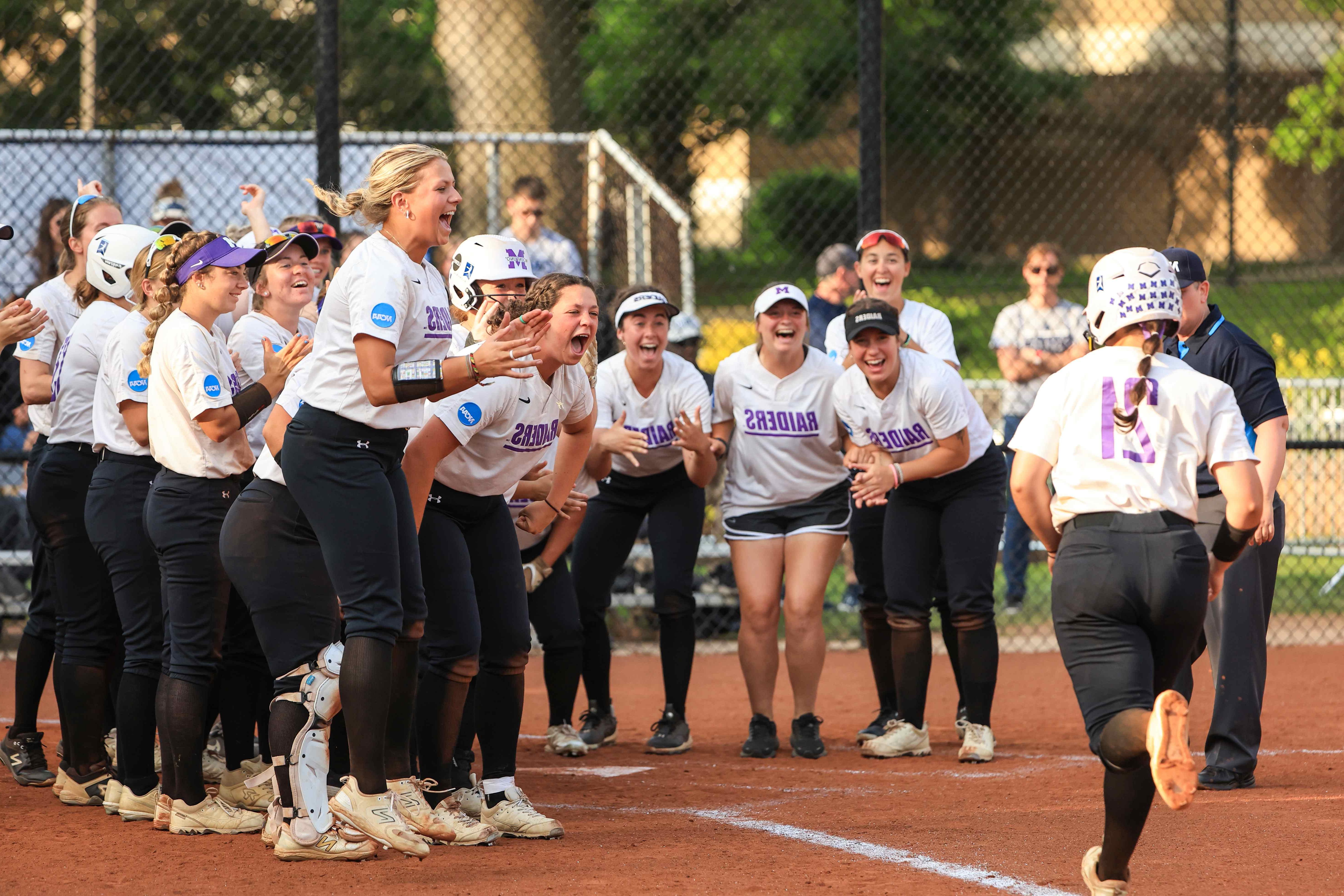 softball team celebrating